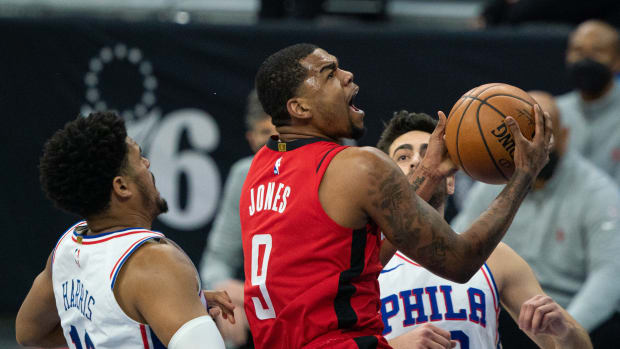Feb 17, 2021; Philadelphia, Pennsylvania, USA; Houston Rockets guard Mason Jones (9) goes to the basket against Philadelphia 76ers forward Tobias Harris (12) during the second quarter at Wells Fargo Center. Mandatory Credit: Bill Streicher-USA TODAY Sports  